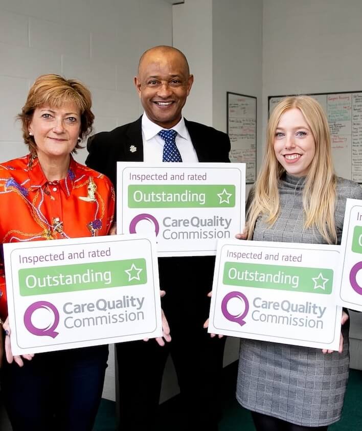 Our team in the office at Home Instead Wandsworth displaying our CQC outstanding rating