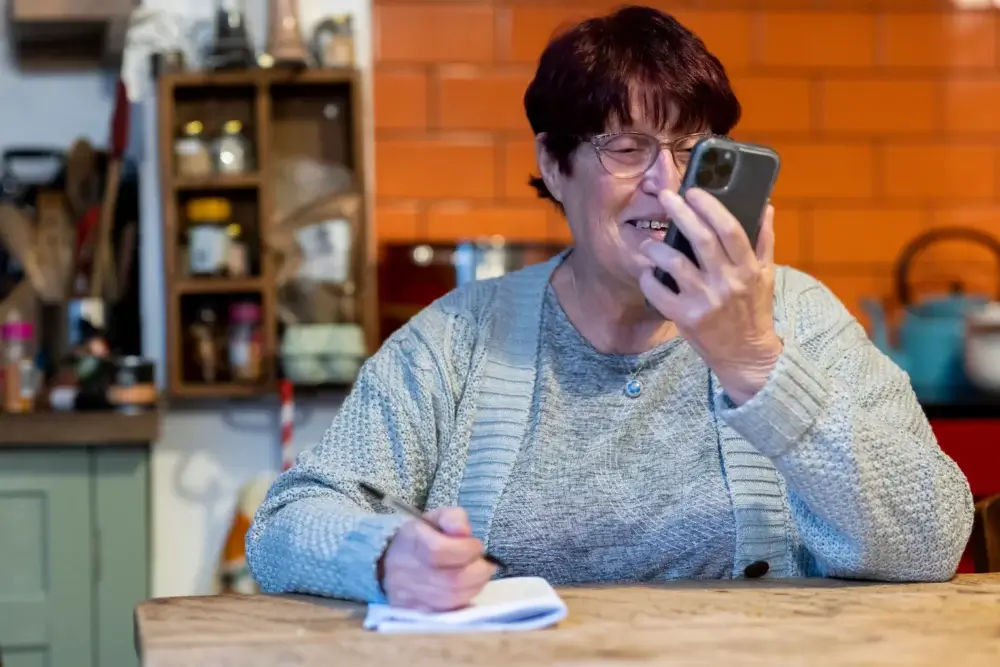Senior using technology to stay connected and socially engaged