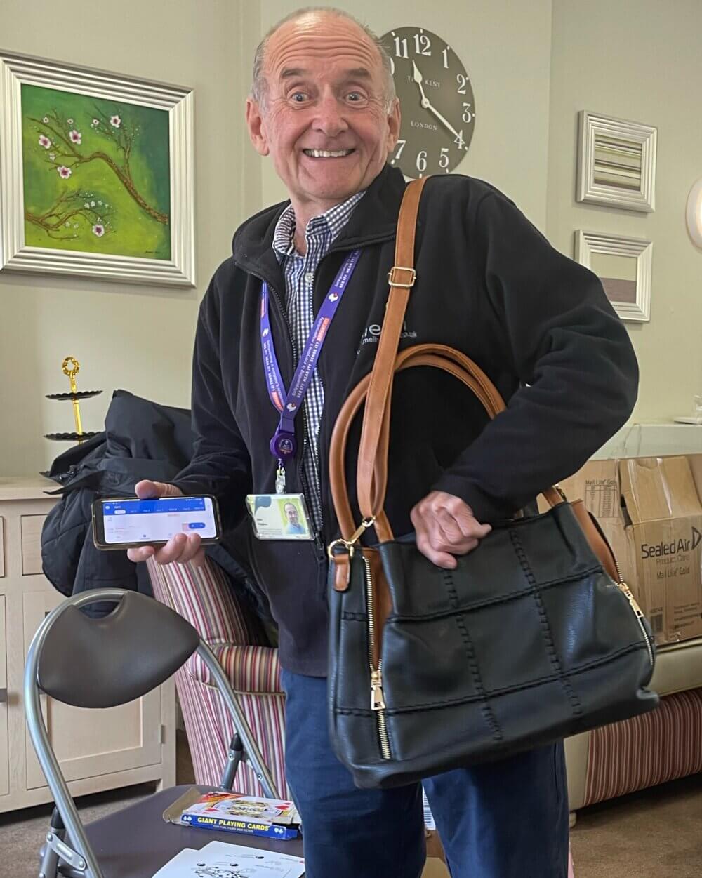 Alan Hughes of Melin Homes wins a special prize on the Easter raffle.